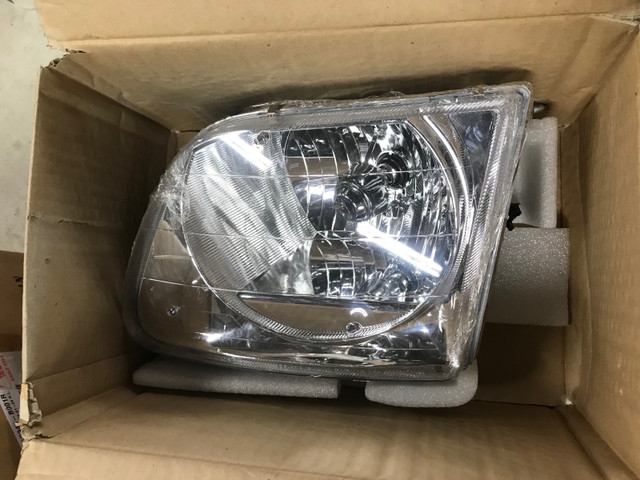 2003 ford F150 new head lights  in Auto Body Parts in Thunder Bay