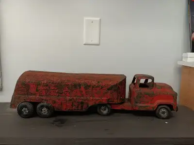 Vintage 1950,s Buddy L pressed steel Tanker truck..24 inches long..definetly has paint fade over the...