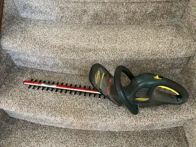 Get your garden looking pristine with this Yardworks hedge trimmer, perfect for tidying up shrubs an...