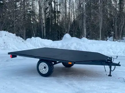 Quad Sled trailer. Ramps are made for quads or sleds. New decking and paint. Wheel bearings recently...