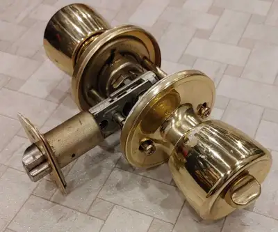 Defiant Exterior Locking Door Knob polished brass finish, View more