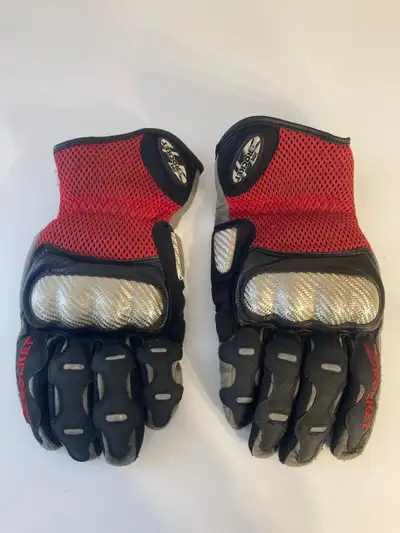 I am selling a pair of Joe Rocket motorcycle gloves, perfect for any rider seeking protection and st...