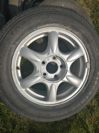 One Firestone 225/60r16 on new GM alloy rim in excellent cond