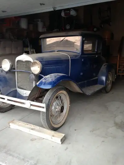 1930 model A 5 window with trunk. Okay shape require work but is solid. Garage kept and motor turns.