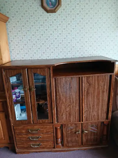 Room for all your media display and storage. It's in good condition considering its age. It features...