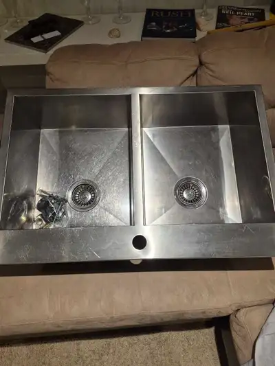 This is a used Steel Queen double kitchen sink, accompanied by a stylish Riobel faucet. Here are som...