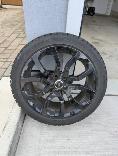 A set of rims and tires for Range Rover Evoque and similar vehicles. Tires are Bridgestone Blizzaks...