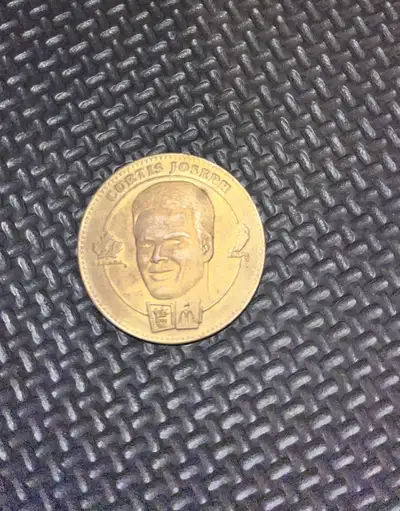 Up for grabs is a Curtis Joseph/Martin Brodeur collectible coin, a cool piece of hockey memorabilia!...