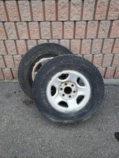 2 truck tires for sale 1 rim has little rust Can sell tires separately 225 75 r16 kumho tires all se...