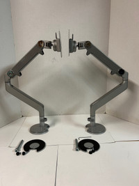 Humanscale M8 bolt trough monitor arms.