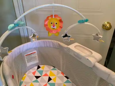 Bassinet ... with Accessories ... Like NEW .... by Fisher Price ... Quiet motion and very smooth ......