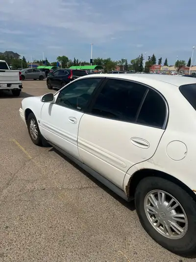 This Buick LeSabre is a reliable sedan featuring a spacious interior and a smooth ride, ideal for th...