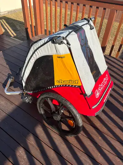 Chariot bike trailer for sale. Two seats, harnesses, lots of storage, bug screen and rain screen. Fo...