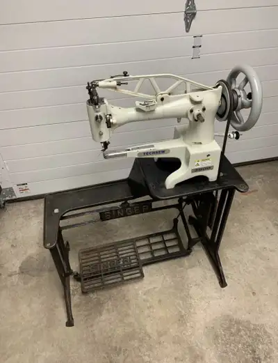 Techsew 2900 industrial cylinder arm walking foot sewing machine with singer treadle base/table. The...