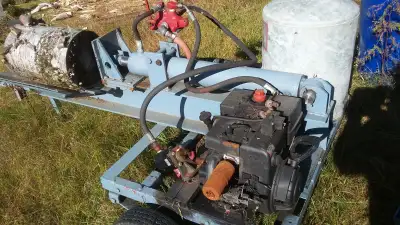 WOODSPLITTER on nice trailer - Needs a little work; used last fall. Old motor works, but I can inclu...