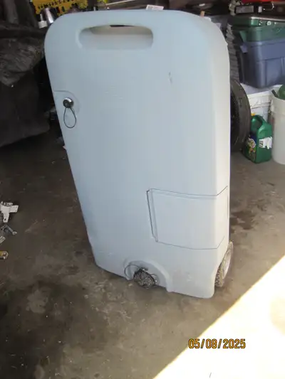 THEDFORD 32 gal sewage tote with ohses and tow handle very clean has been in storage for years 250 $...