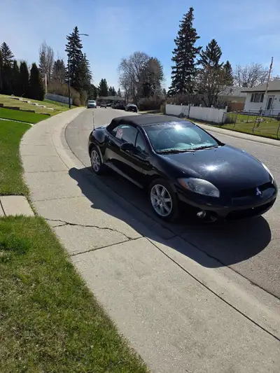For sale is a used 2007 Mitsubishi Eclipse convertible with 146290 km, offering a fun, open-air driv...