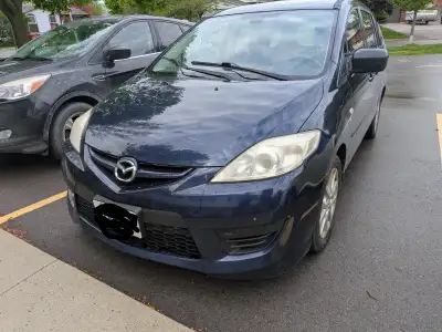 Selling well loved Mazda 5, car is selling as is and is probably a part out. Check engine light is o...