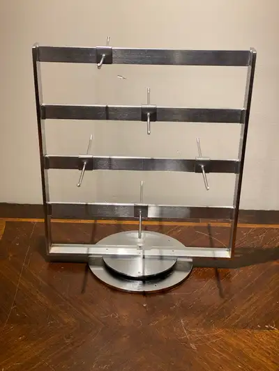 15 pound metal display rack Swivels nicely Has removable levels and hooks Pickup in Spruce Grove