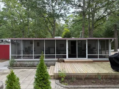 This pre-owned RV screen room provides an expansive, bug-free outdoor living space, perfectly design...