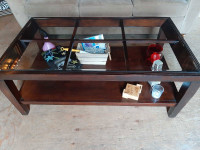 Hard wood coffee table with glass top 