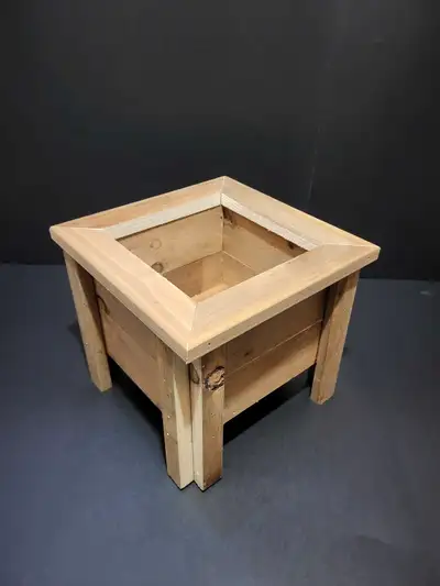 Mini square wooden planter box. Simple design, perfect for small plants or succulents. Made of light...