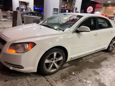 This is a 2009 Chevrolet Malibu, a reliable sedan perfect for daily commutes and family trips, offer...