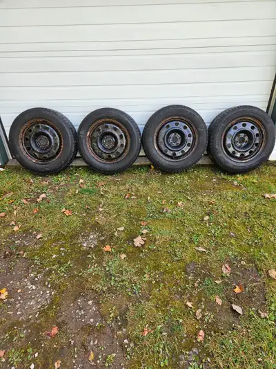 Four used Michelin Latitude X-Ice snow tires on rims. Tread still has a couple of winters of wear. S...