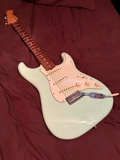 Fender vintera 60’s Strat in surf green. The guitar looks and sounds great, was professionally set u...