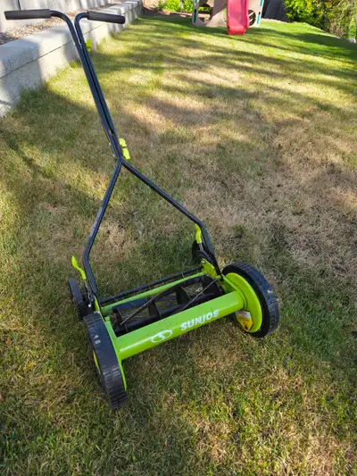 Sun Joe 14In classic Quad wheel 9 position manual walk behind reel mower. Used one season, like new...