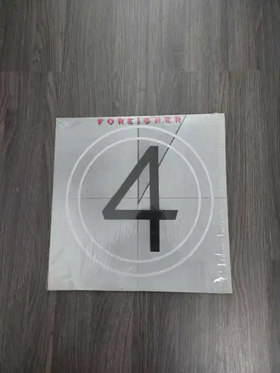 Foreigner- 4 Cover - Near Mint Vinyl - Very Good + Asking $15 CAD Still in it's original shrink! Be...