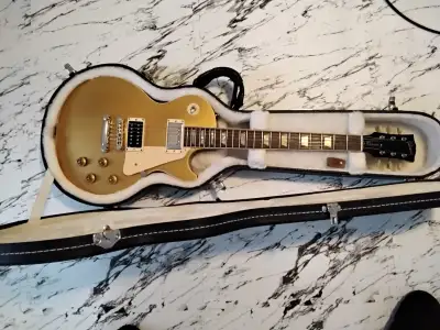 2006 Les Paul Classic Gold Top. Has 1960 on the pickguard. Some dings and scratches in the finish. A...