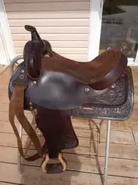 Western saddle with cinch and pad