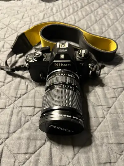 Nikon EM Black 35mm SLR Camera with 28-80mm 1:3.5-4.2 Lens, View more