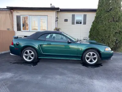 Mustang convertible 2002. V6 automatique vert forêt vitre+porte électrique. Volant inclinable, cruis...