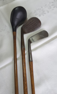 3 Antique THISTLE wooden handled golf clubs.