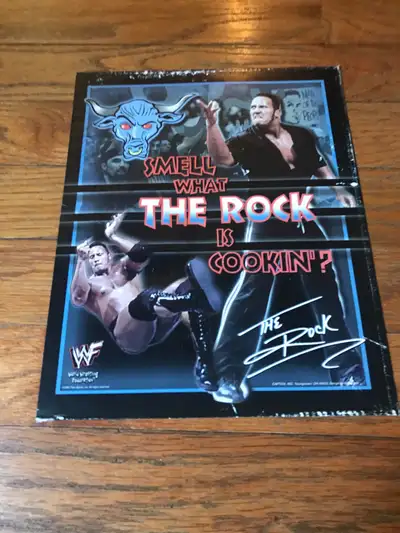 Own a piece of wrestling history with this vintage 'The Rock' poster! This poster, showcasing Dwayne...