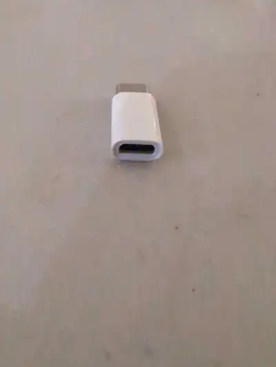 This micro USB to USB-C adapter allows you to connect devices with different USB ports; it is in use...