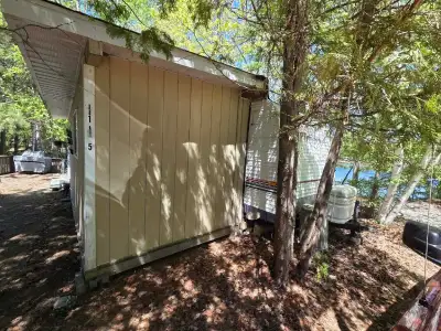 This used Pioneer travel trailer is perfectly situated on lot 115 at South Bay in Elliott Lake, offe...