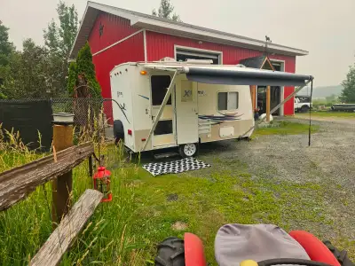 SELLING OUR 2009 EXTREME LITE CAMPER TRAILER. ONLY 13 FEET LONG. TOW WITH CAR OR SMALL SUV TWO PROPA...