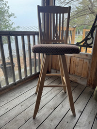 Three solid wood bar stools, swivel base