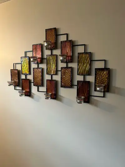 Nice piece. Comes from Costco. Holds 8 tea light candles.