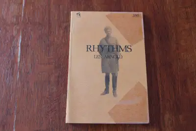 Rythms. By Les Arnold. Softcover. The front cover corners have tape on them. The book has been disca...