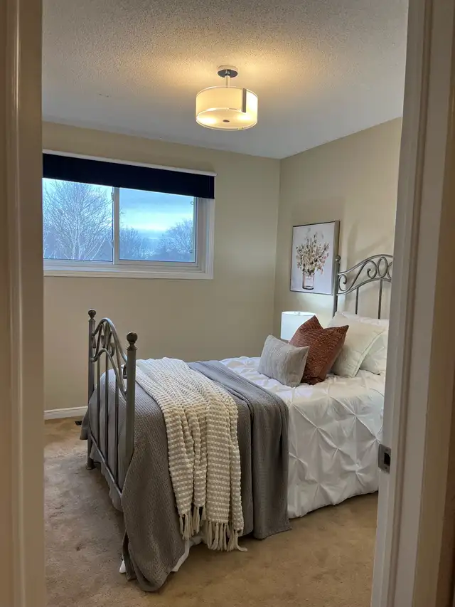 Iron twin bed with mattress, boxspring, and mattress topper. in Beds & Mattresses in Oshawa / Durham Region - Image 3