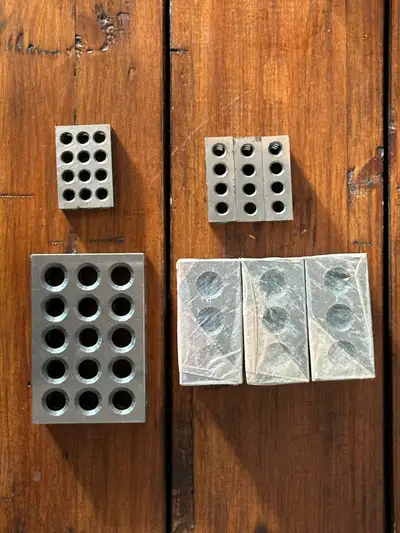 2 sets of 4 machinist blocks. 4 - 19 hole 1 inch by 1.5 inch block set and 4 - 23 hole 2 inch by 3 i...