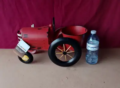 New Metal Tractor Planter, About 16" long x 7" wide, $25, View more