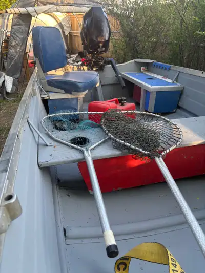 Boat trailer and 9.8 tohatsu motor with only 20 hours Boat and trailer refurbished