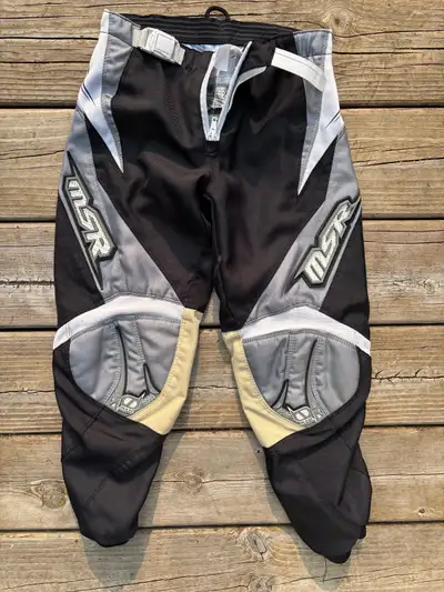 Get ready to ride with these MSR Axxis motocross pants, size 24, designed for optimal performance on...