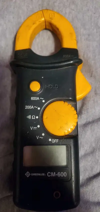 Greenlee CM -600 clamp meter in excellent working condition. Fully functioned and tests volts, amps...