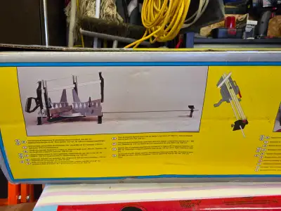 Hand operated miter saw with blade, new in the box, View more